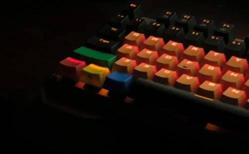 orange, black, and green mechanical keyboard